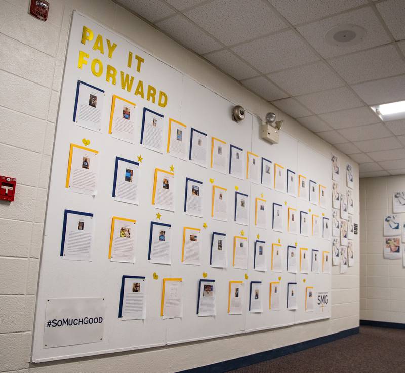 The ‘Pay it Forward’ wall shows service projects  done by students in 8th grade at Saint Mary of Gostyn School's Open House in Downers Grove on Sunday, Jan. 29, 2023.