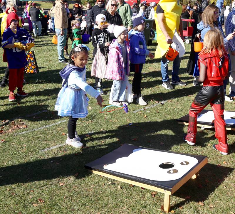Talayah Finley plays one of the many Halloween themed games at Batavia Bat Fest on Saturday, Oct. 26, 2024.