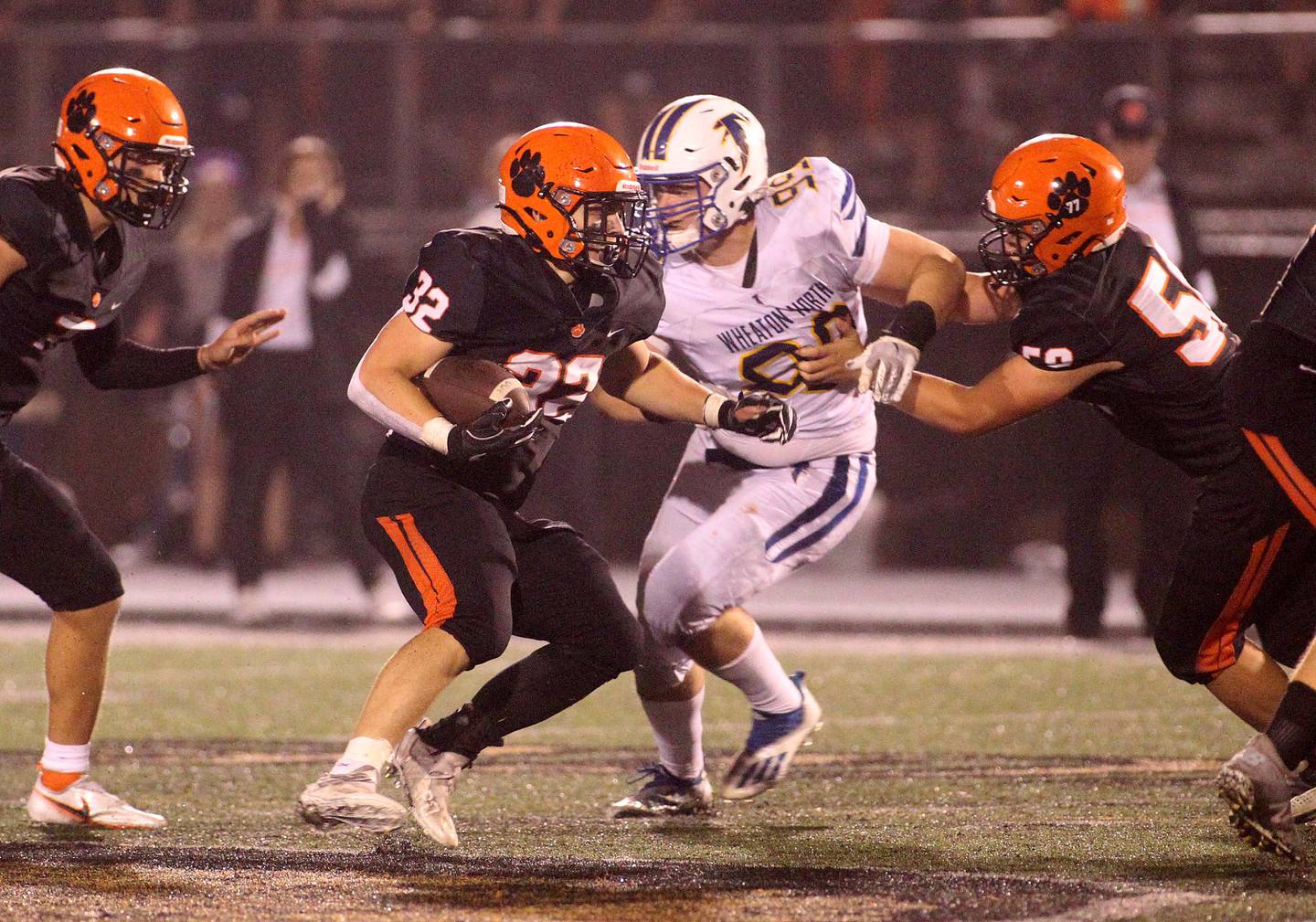 Wheaton Warrenville South's Lance Kottke (32) carries the ball during a home game against Wheaton North on Friday, Oct. 8, 2021.