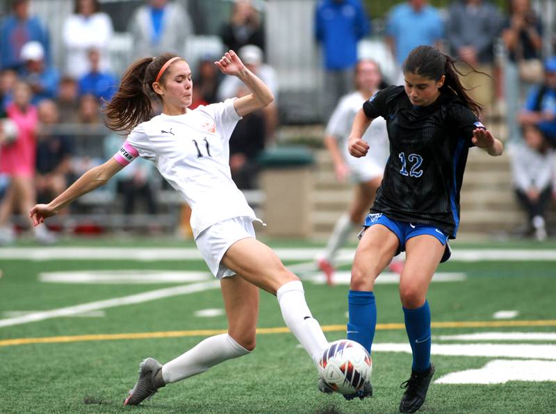 Wheaton Warrenville South's Ella Byrnes and St. Charles North's Madisen Shanahan go after the ball during the Class 3A Glenbard West Sectional final against St. Charles North on Friday, May 30, 2025 in Glen Ellyn.