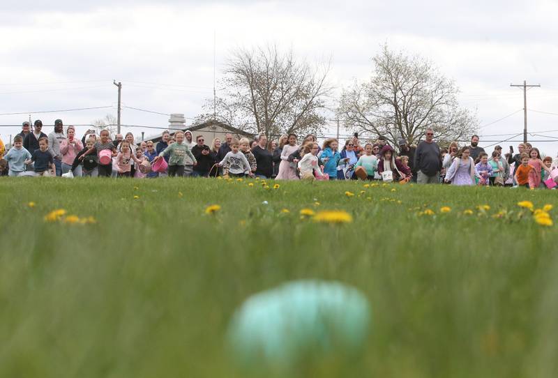Kids race to find Easter eggs during the annual Eastear egg hunt on Saturday, April 19, 225 at Carey Memorial Park in Utica.