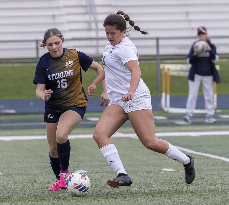 Sterling’s Illyana Moreno and Moline’s Charlise Martel battle for the ball Tuesday, April 30, 2024 at Sterling High School.