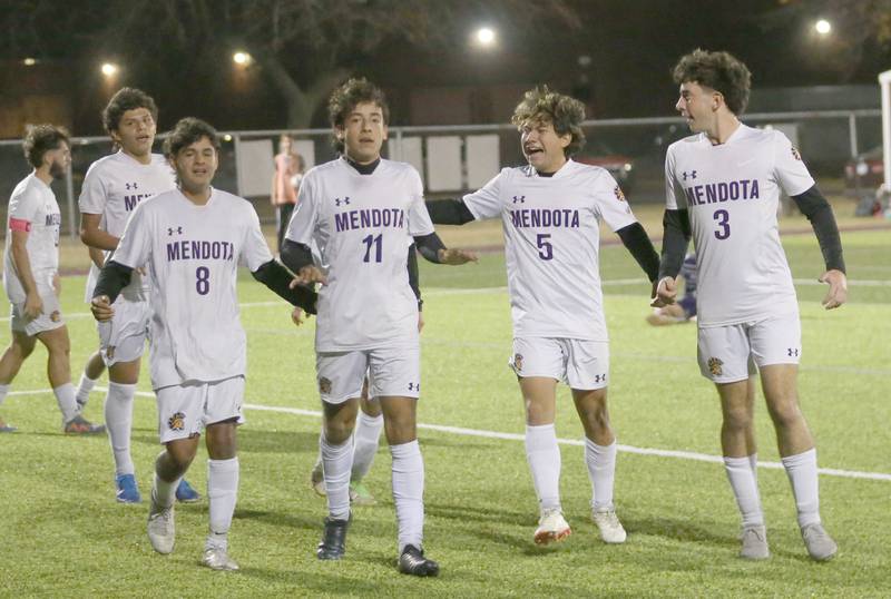 Members of the Mendota soccer team celebrate after scoring the second goal against Peoria Christian during the Class 1A Sectional game on Wednesday, Oct. 30, 2024 at Chillicothe High School.