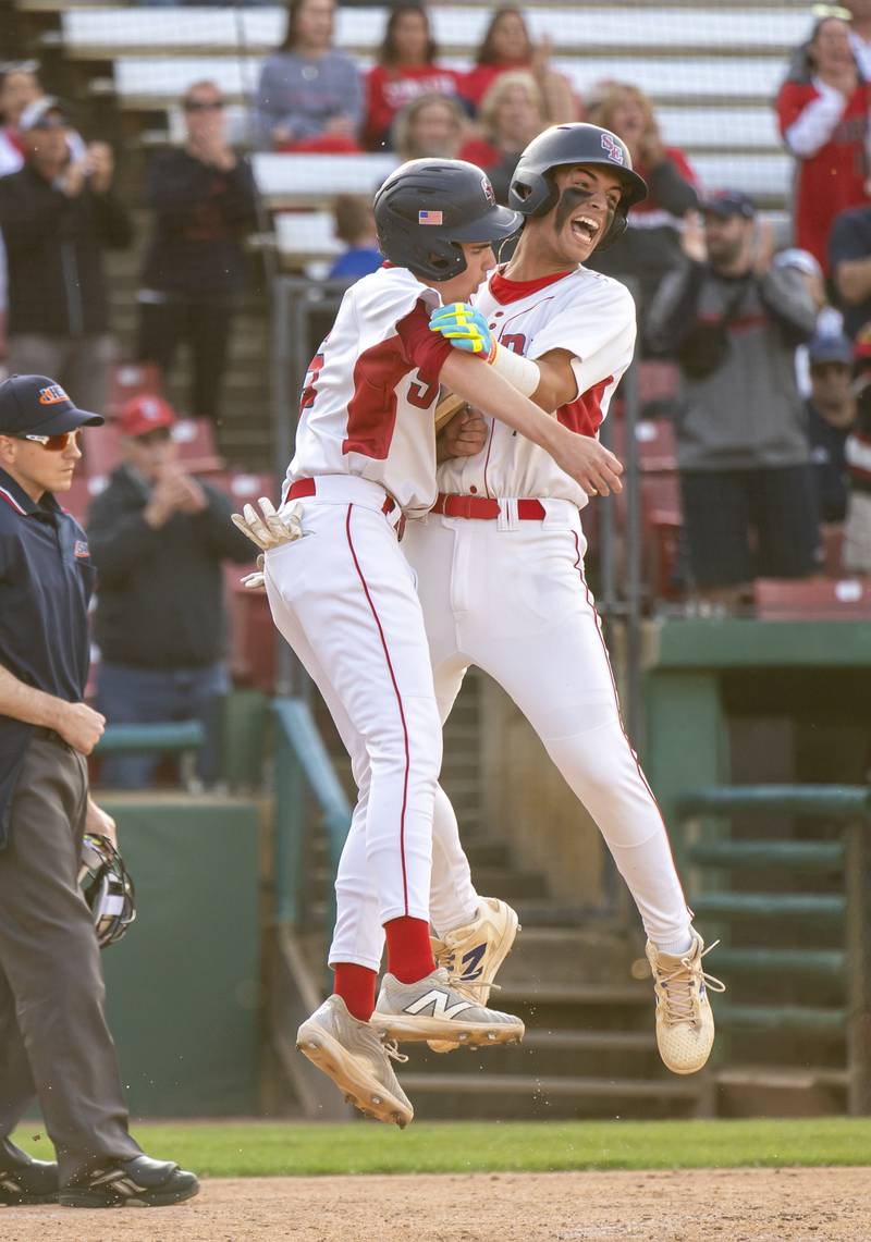 South Elgin's Alex Muro, left, and Zacharia Barkho celebrate after Muro scored a run during the boys baseball Class 4A Kane County Cougars Supersectional against McHenry on Monday, June 9, 2025 at Northwestern Medicine Field in Geneva. Ryan Rayburn for Shaw Local