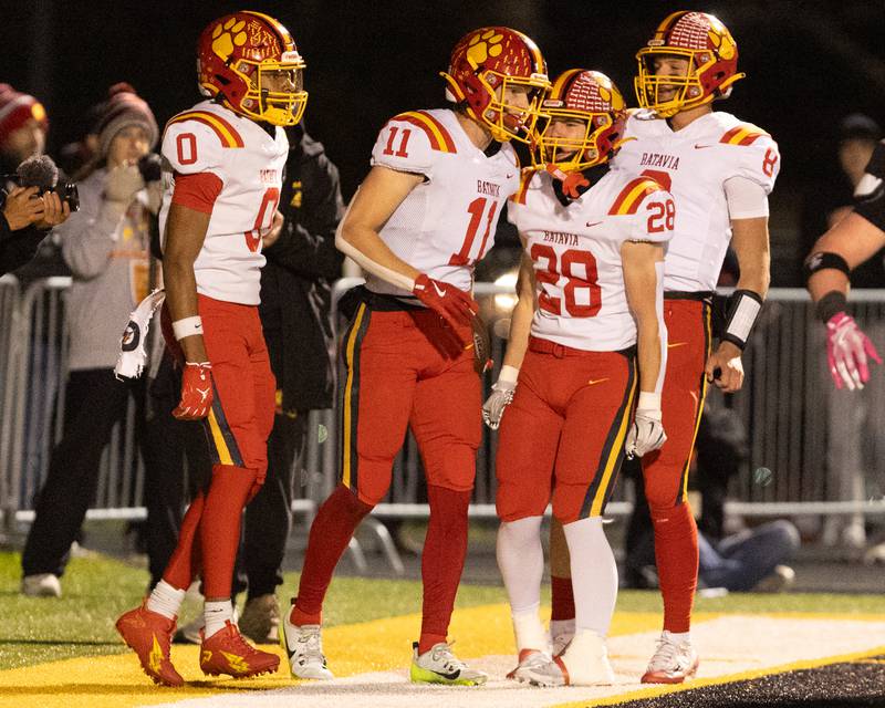 Batavia celebrates a touchdown against Wheaton Warrenville South on Friday, Oct. 24,2025 in Wheaton.