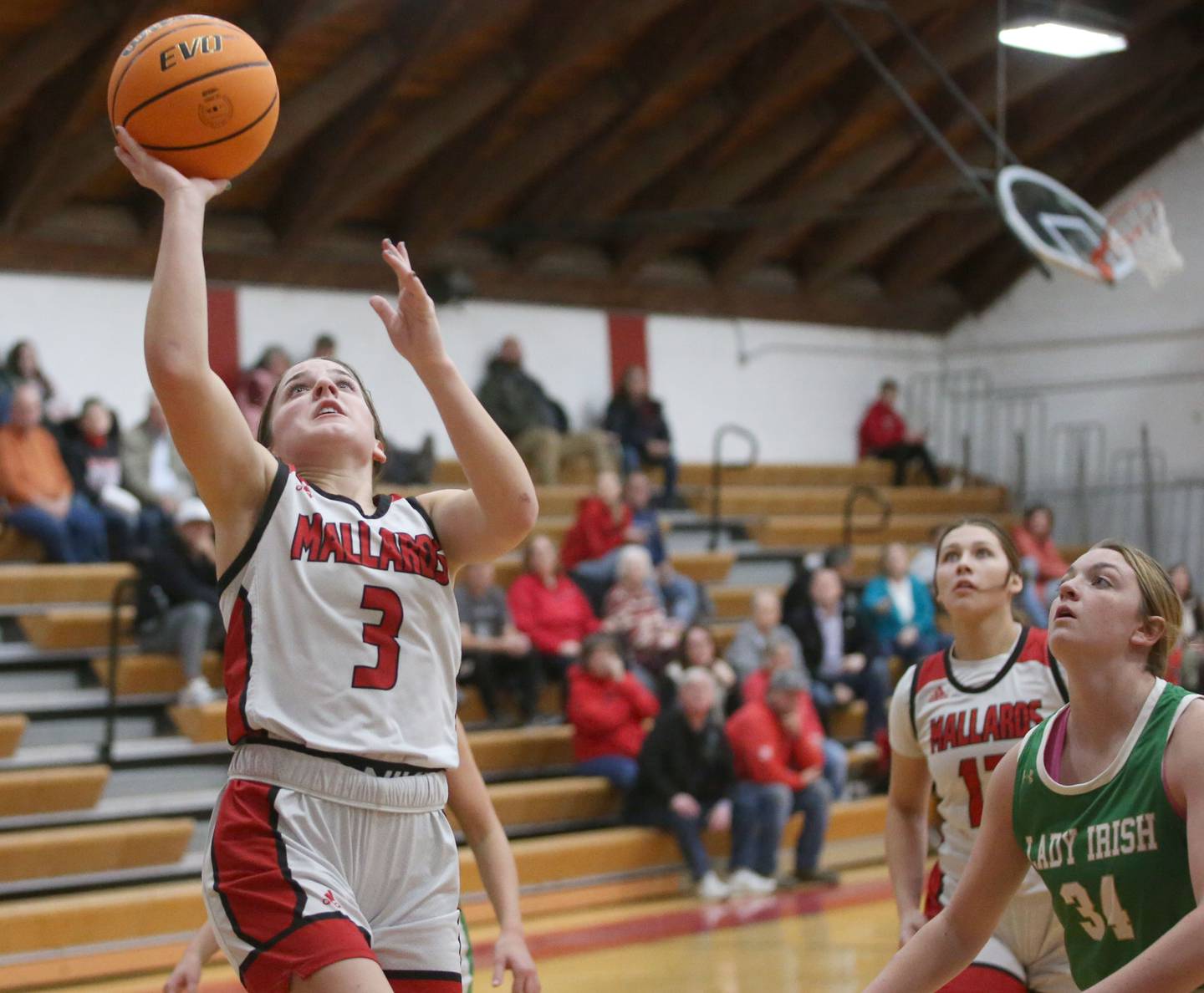 Henry-Senachwine's Lauren Harbison eyes the hoop while scoring on a layup over Seneca's Tessa Krull on Monday, Jan. 13, 2024 at Henry-Senachwine High School.