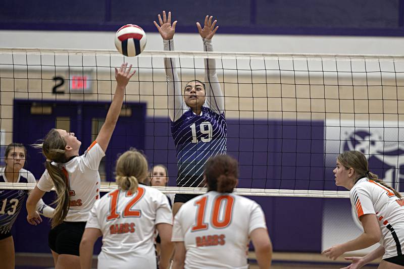 Dixon’s Hallie Williamson goes up to block a shot against DeKalb Tuesday, Sept. 5, 2023 in a game at Dixon High School.