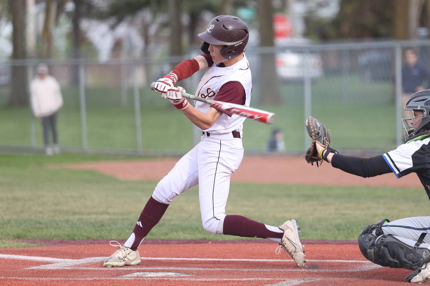 Lockport’s Adam Kozak connects against Lincoln-Way East on Monday, April 22, 2024 in Lockport.