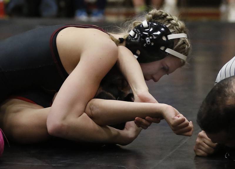 Morris’ Brooklyn Bankowski pins Huntley’s Tanya Pasillas in the 120-pound match of a nononference wrestling meet on Wednesday, Jan. 22, 2025, at Huntley High School.