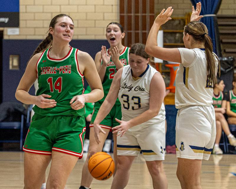 Drew Depenbrock (14) of LaSalle-Peru smiles after making layup as teammate Brianna Ruppert (22) celebrates on Saturday, January 3, 2026 at Marquette Academy in Ottawa.