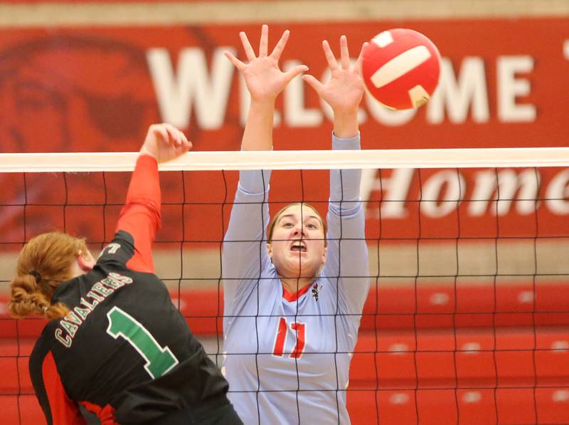 L-P's Addison Duttlinger sends a spike past Ottawa's Oliåvia Evola on Thursday, Sept. 21, 2023 at Kingman Gym.