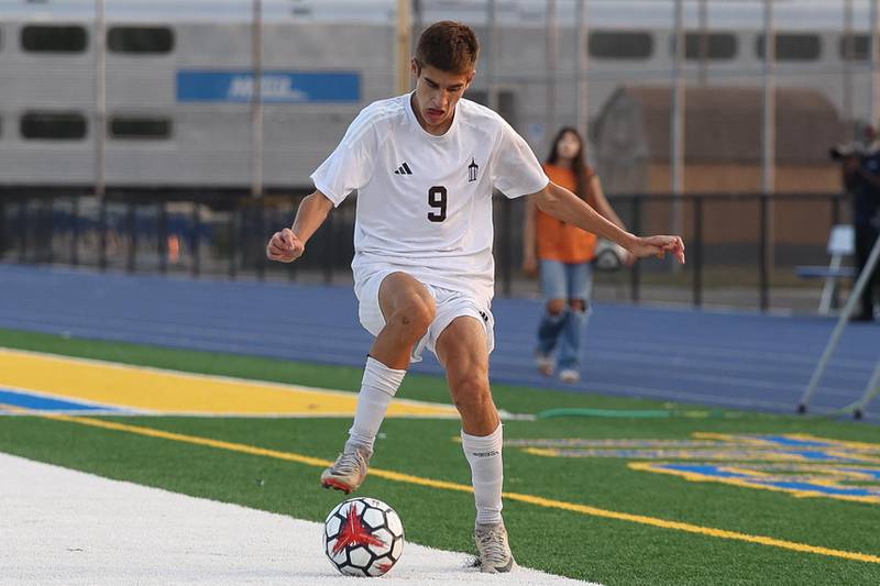Joliet Catholic’s Jackson Kodiak works the ball along the sidelines against Joliet Central on Monday, Sept. 9, 2024 in Joliet.