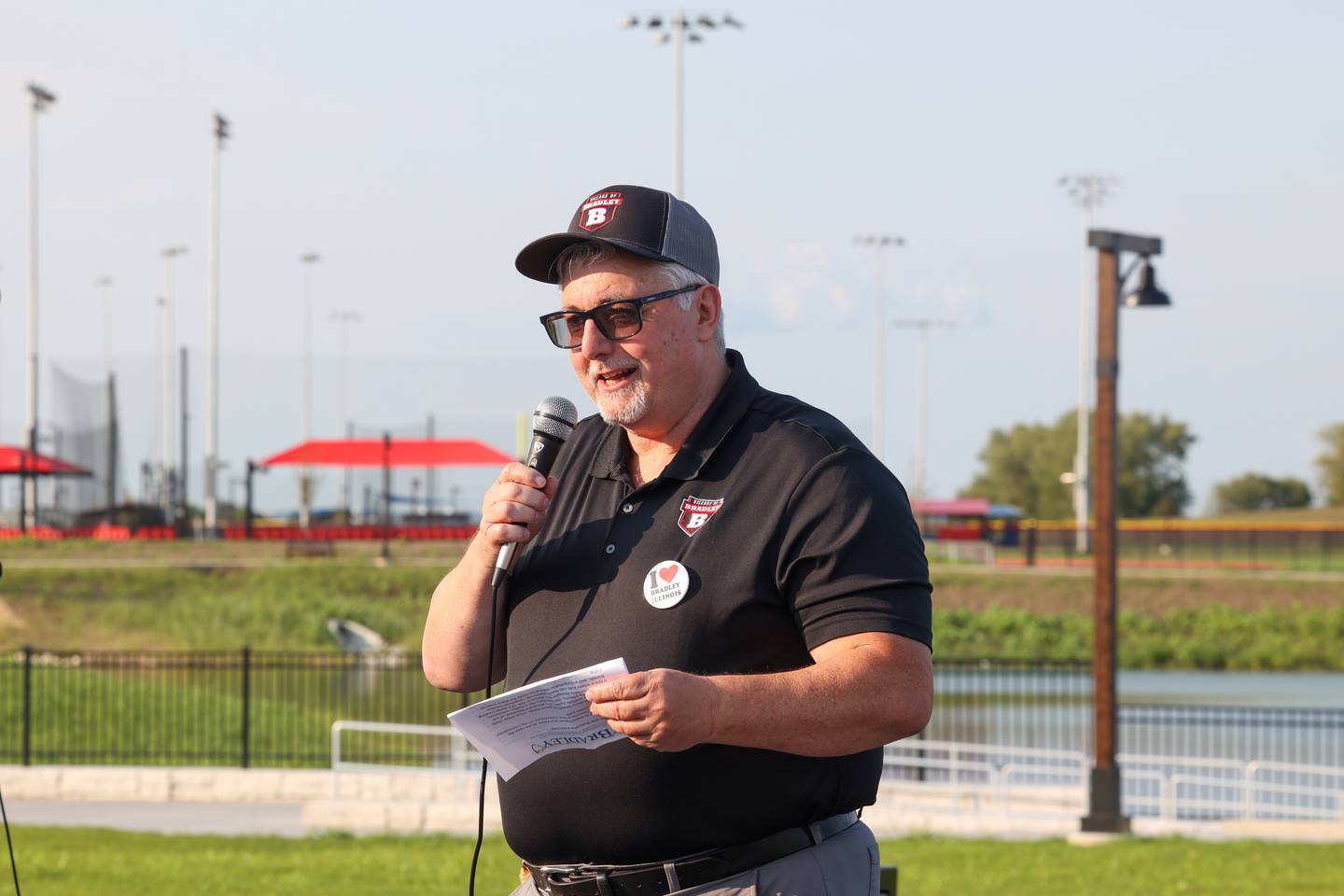 Bradley Mayor Mike Watson speaks to the crowd ahead of a ribbon cutting for Bradley's 315 Sports Park during a Bradley Business After Hours event on Tuesday, July 29, 2025.
