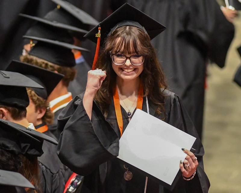 A St. Charles East graduate celebrates after receiving her diploma on Monday, May 18, 2026, held at the Convocation Center in DeKalb.