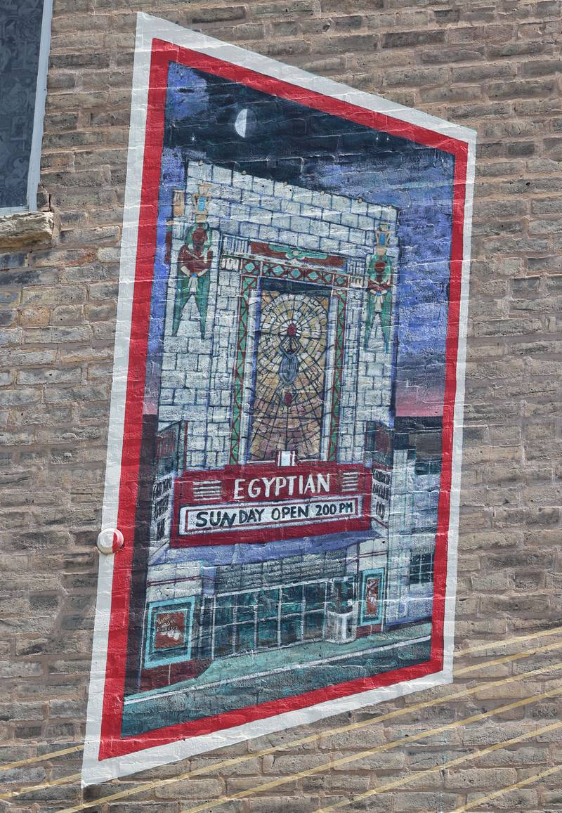 A detail of the mural titled “Its Merits Recommend It...” by artist Olivia Gude Tuesday, July 22, 2025. The artwork graces the side of the building at the corner of Lincoln Highway and First Street in DeKalb.