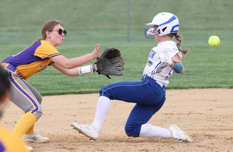 Mendota's Zoe Hanson takes the throw to second base while Princeton's Makayla Hecht slides into the base.
