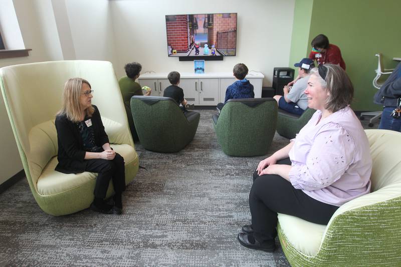 Barb Mason, of Spring Grove, ILC director for Antioch Community High School, talks with Jennifer Drinka, Library Director, in the new Teen Center on Saturday, May 13, 2023, during the Antioch Public Library District Open House in Antioch.