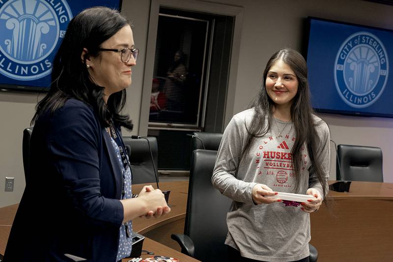 Sterling mayor Diana Merdian congratulates Lexi Rodriguez on her success as Nebraska volleyball player during a ceremony at city hall Monday, Dec. 23, 2024.
