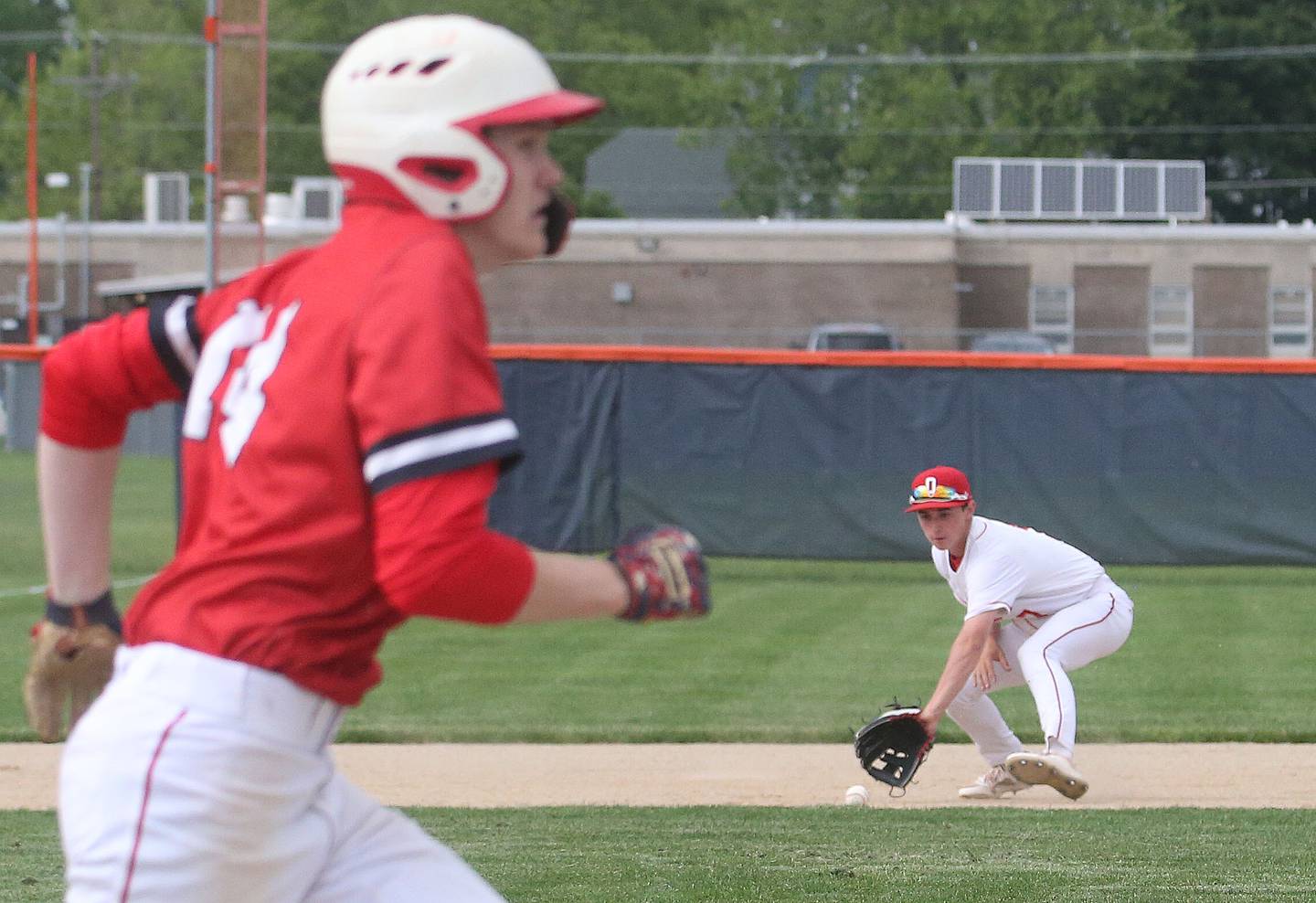 Ottawa's Lucas Farabaugh fields a ground ball as Streator's Blaize Bressner runs to first during the Class 3A Regional semifinal game on Thursday, May 29, 2025 at Pontiac High School.