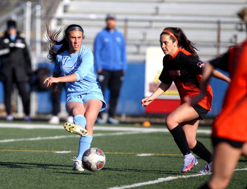 St. Charles North’s Bella Najera (17) kicks the ball during a Tri-Cities Night game against St. Charles East at Geneva High School on Tuesday, April 26, 2022.