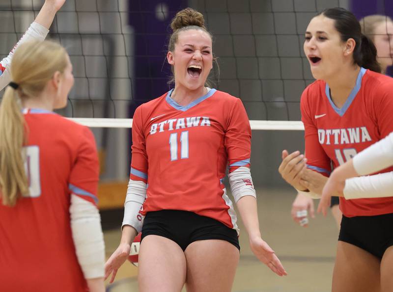 Ottawa players celebrate a point during their match against Dixon Tuesday, Oct. 28, 2025, during their Class 3A regional semifinal match at Rochelle High School.