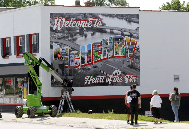 A mural is installed on Thursday, June 19, 2025, on the side of a building at 3413 W. Elm St, in McHenry by Vindictive Vinyl.