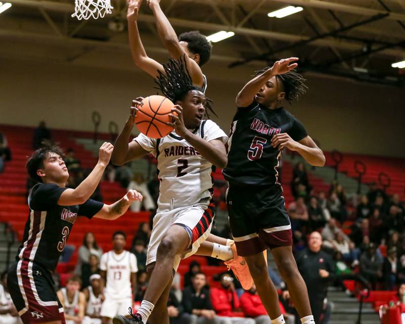 Bolingbrook's Darius Hudson (2) grabs a rebound during their basketball game between Plainfield North at Bolingbrook, Friday Dec 13, 2024 in Bolingbrook.
