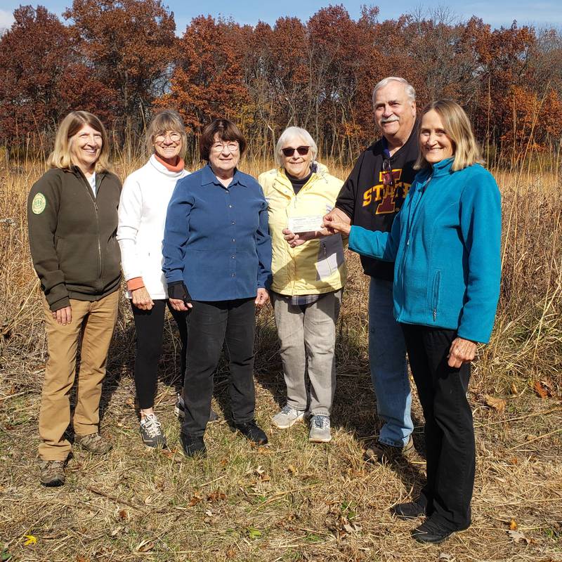 Friends of Dundee Natural Areas members (left to right) Sue Bohne, June Keibler, Susanne Masi, Rose Johnson and George Johnson accept a $2,000 check from Carol Weinhammer of the Algonquin Garden Club.