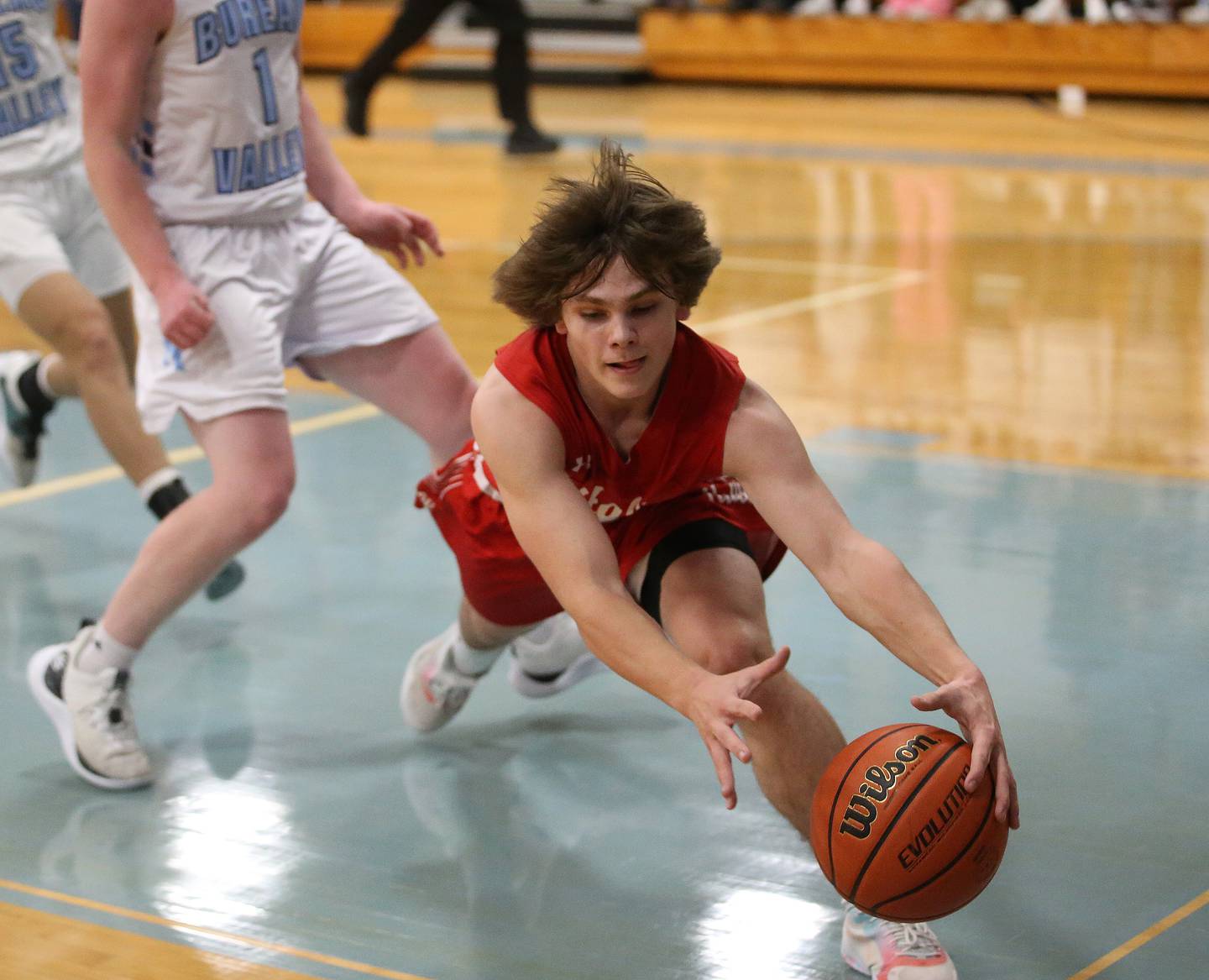 Hall's Greyson Bickett grabs the ball before it goes out of bounce on Friday, Jan. 19, 2024 at Bureau Valley High School.