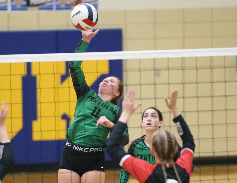 Leland's Izzy Podnar spikes the ball past Earlville during the Class 1A Regional semifinals on Monday, Oct. 27, 2025 at Somonauk High School.