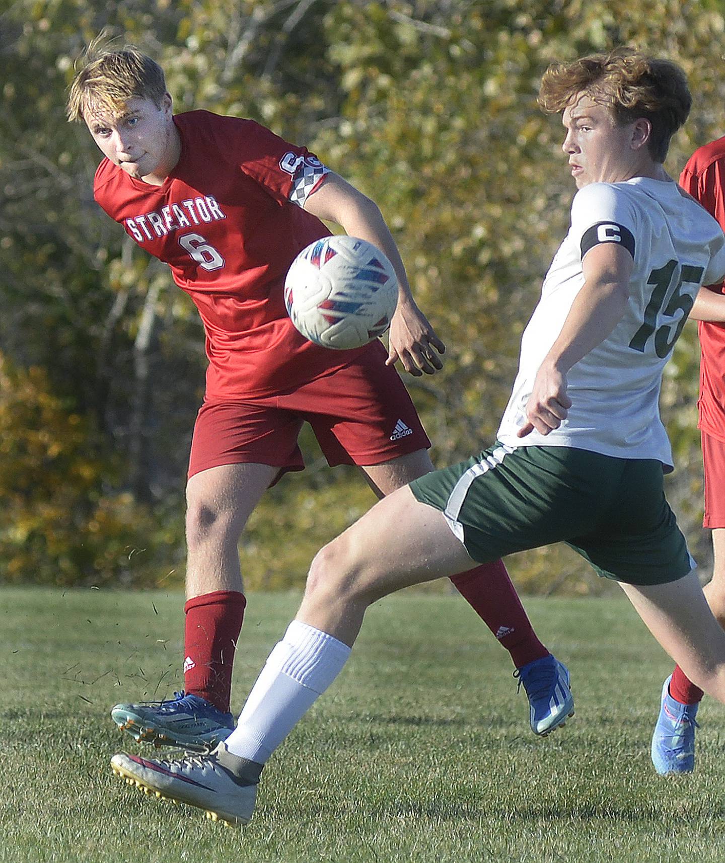 Streator’s Noah Russow gets to the ball ahead of Coal City’s Sam Sterba in the first half of Tuesday's Illinois Central Eight Conference match at the James Street Recreation Center in Streator.
