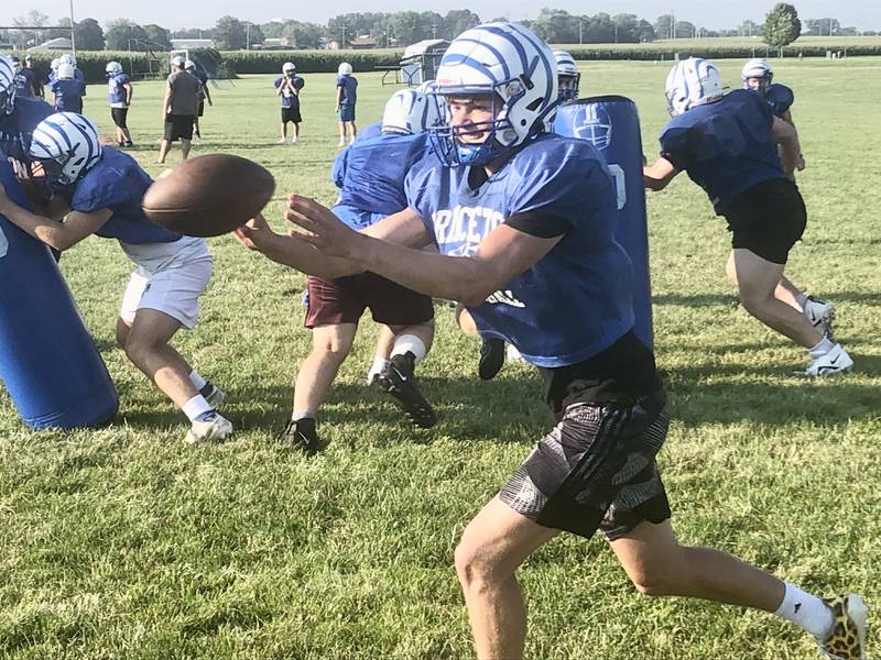 Princeton senior quarterback Teegan Davis makes a pitch during Wednesday evening's session of the Tiger Team Camp at Little Siberia Field. Camp continues through Friday morning.