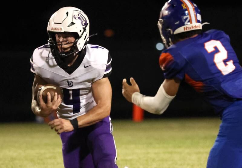 Dixon's Landon Knigge looks to get by Genoa-Kingston's Tyler Atterberry during their game Friday, Sept. 20, 2024, at Genoa-Kingston High School.