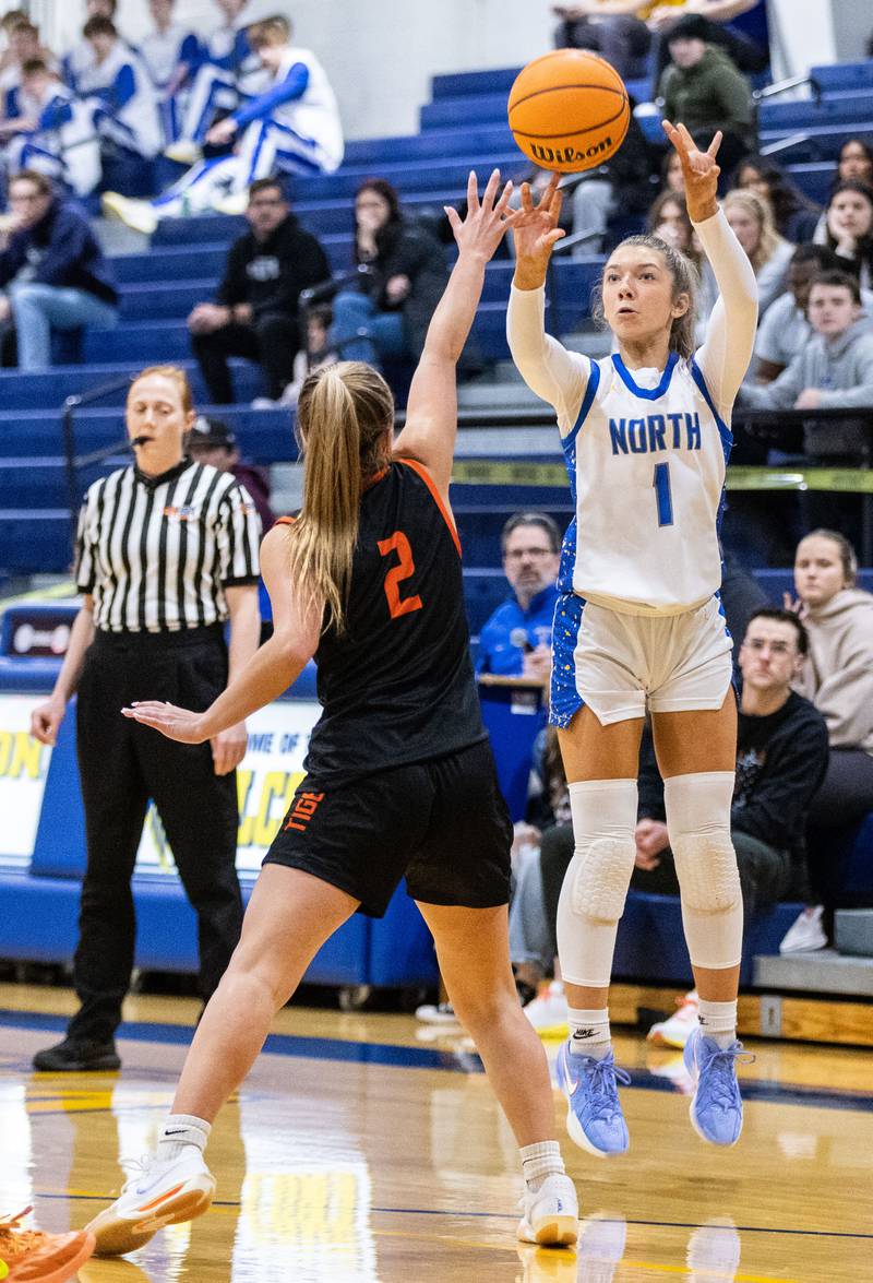Wheaton North’s Adeline Sutton shoots a three-point field goal during a home game against  Wheaton Warrenville South on Friday, Dec. 20, 2024.