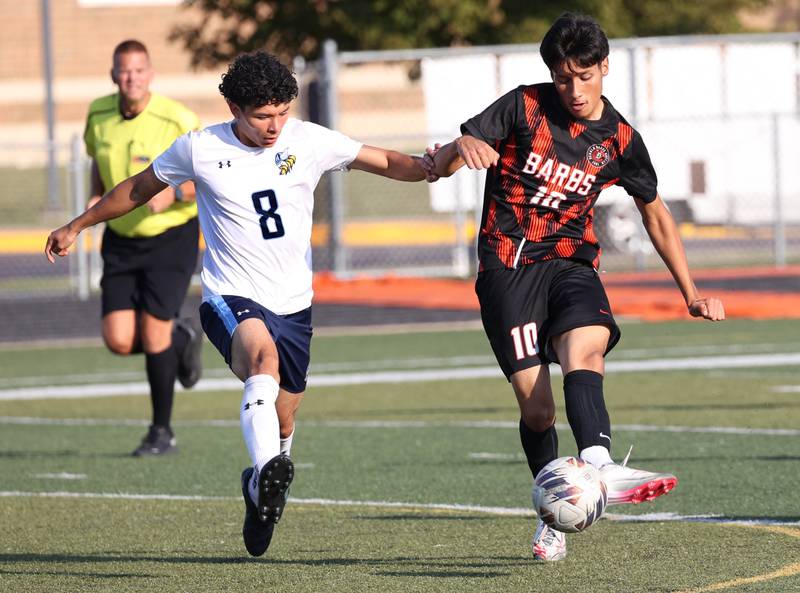 DeKalb's Jorge Correa (right) tries to hold off Guilford's Leonardo Hernandez during their game Thursday, Sept. 18, 2025, at Dekalb High School.