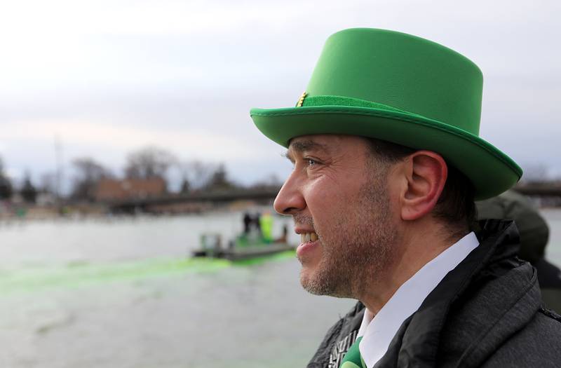 Paul Moran of McHenry watches as the Fox River is dyed green during the McHenry’s ShamROCKS the Fox Festival on Saturday, March 14, 2026, in McHenry.