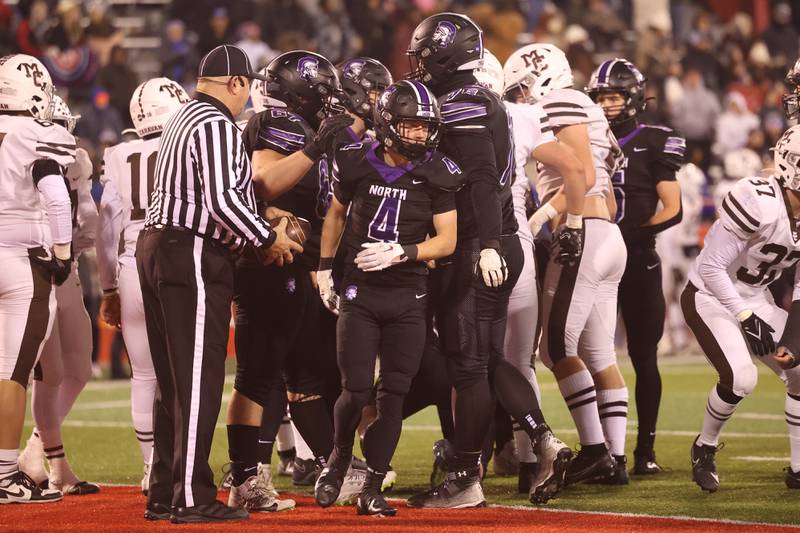 Downers Grove North’s Jake Wander, 4, leaves the huddle after a touchdown against Mt. Carmel in the Class 7A championship on Saturday, Nov. 25, 2023 at Hancock Stadium in Normal.