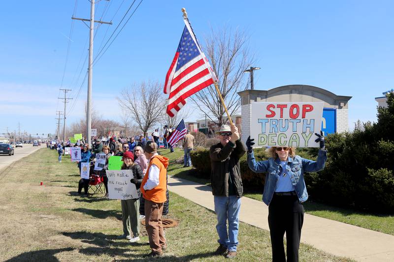 Protesters against the Trump administration attend the No Kings demonstration along U.S. Route 34 in Oswego on Saturday, March 28, 2026.