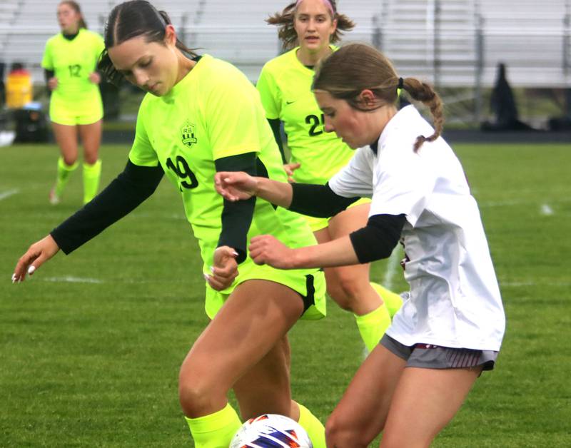 Marengo’s Regan Heimsoth, right, battles Richmond-Burton’s Hannah Denman in IHSA Class 1A Regional Title Game action soccer at Marengo High School in Marengo on Wednesday, May 21, 2025.