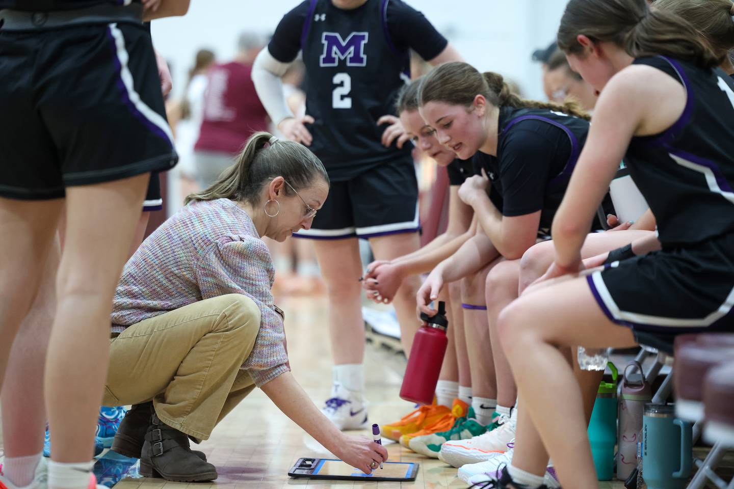 Manteno head coach Bethany Stritar lays out a play to her team in a timeout during Manteno's 57-52 victory over Watseka/Milford on Wednesday, Jan. 21, 2026.