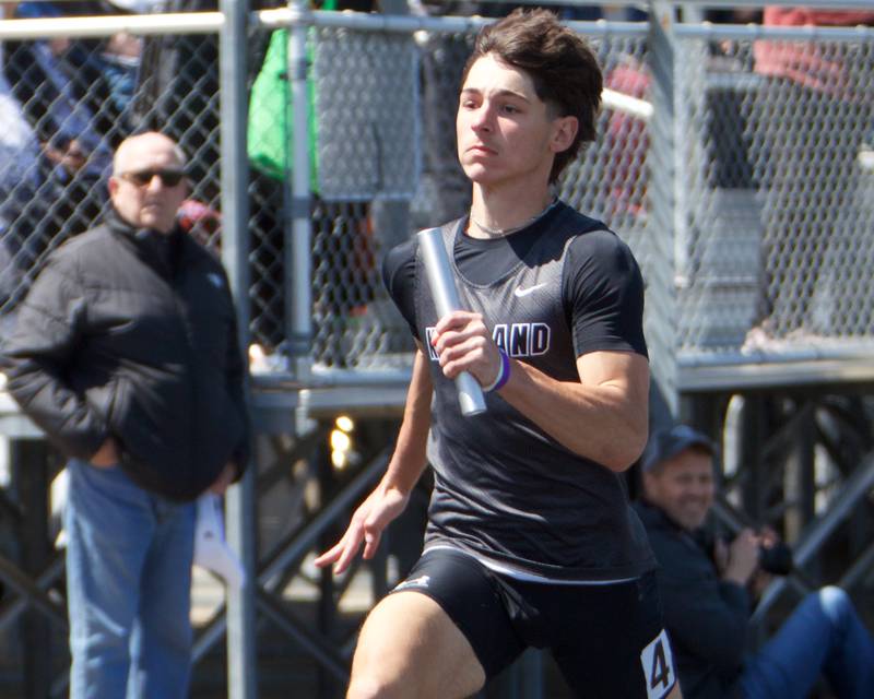 Kaneland's Luke Gadomski competes in the 4X100 Relay at Kaneland's Peterson Prep invite on Saturday, April 26,2025 in Maple Park.