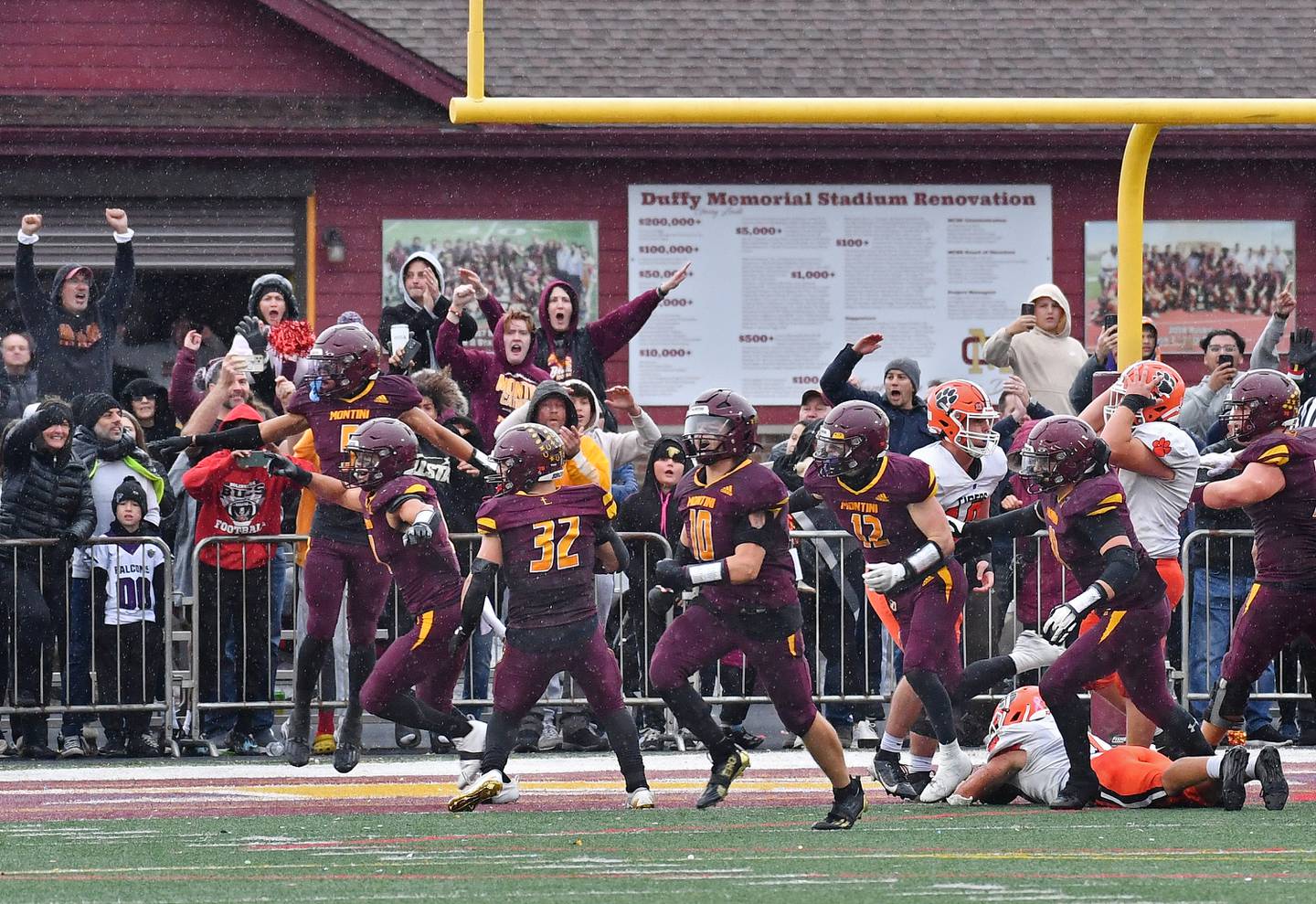 Montini fans and players start to celebrate after stopping Byron's 2-point conversion attempt to clinch a 14-13 win in a Class 3A second-round game on November 9, 2024 at Montini Catholic High School in Lombard.