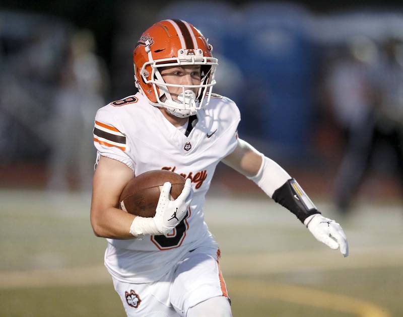 Hersey's Carson Grove (8) heads upfield  Friday September 1, 2023 in Palatine.