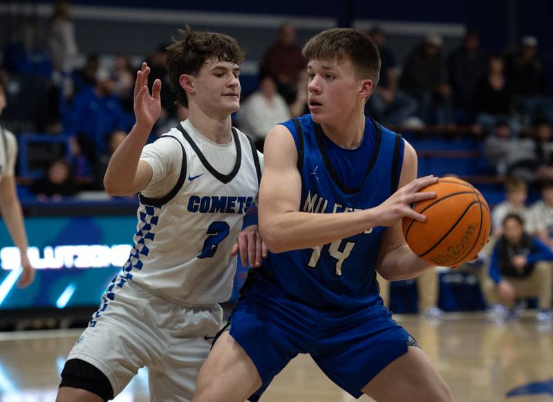 Milford's Jack VanHoveln controls the ball as Clifton Central's Kaden Neveu, left, guards during a Class A Regional game on Monday, Feb. 23, 2026.