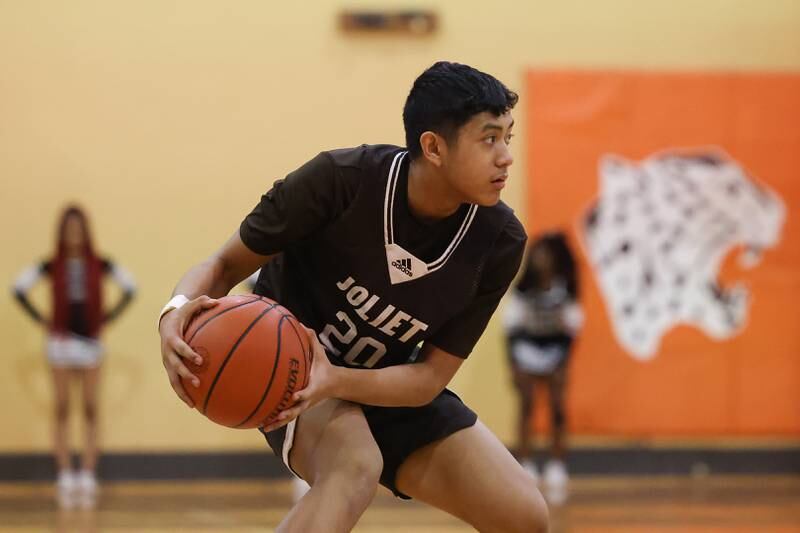 Joliet Catholic’s James Pilapil looks for a play against Prespectives in the Class 2A Julian Sectional championship on Friday, March 3rd, 2023 in Chicago.