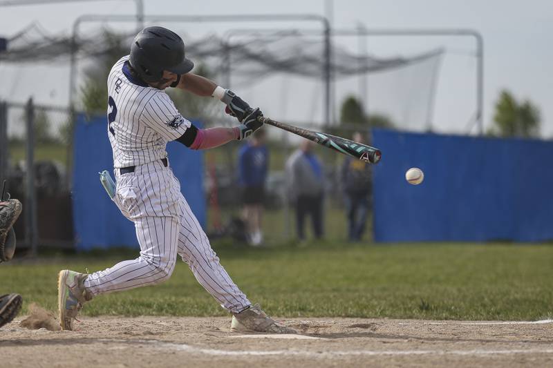 Oswego East's Devin Wheaton (2) connects on a pitch during baseball game between Oswego East at Oswego. Monday, May 19, 2025 in Oswego.