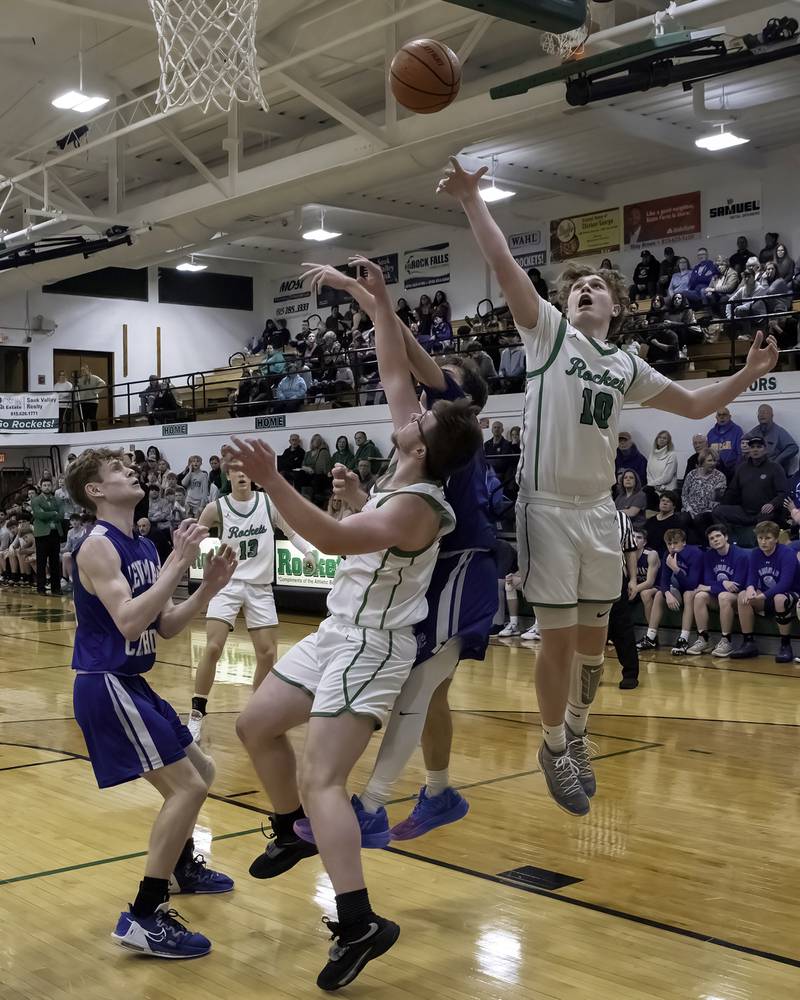 Rock Falls' Kuitim Heald (10) and Chevy Bates go after a rebound against Newman's Nolan Britt during their nonconference game Wednesday, Feb. 15, 2023 at Tabor Gym.