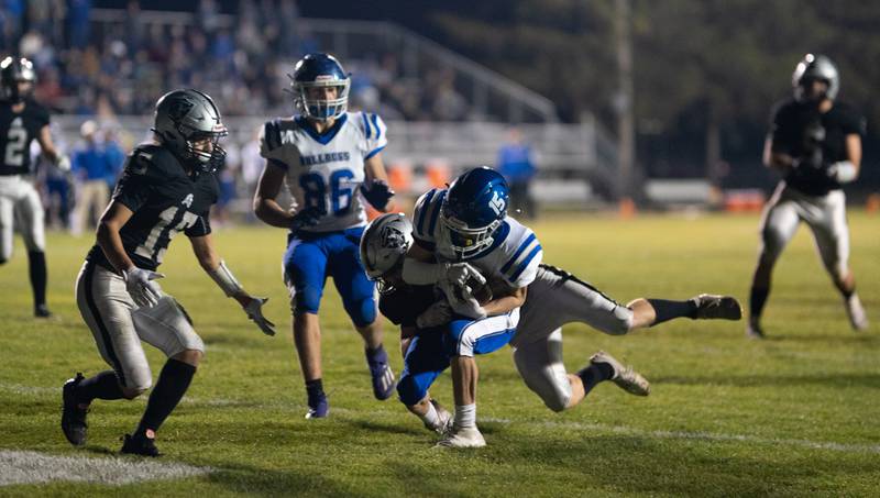 Riverside Brookfield's Ethan Tucker (15) catches a touchdown pass against Kaneland’s Anthony Urban (24) during a 6A playoff football game at Kaneland High School in Maple Park on Friday, Oct 28, 2022.