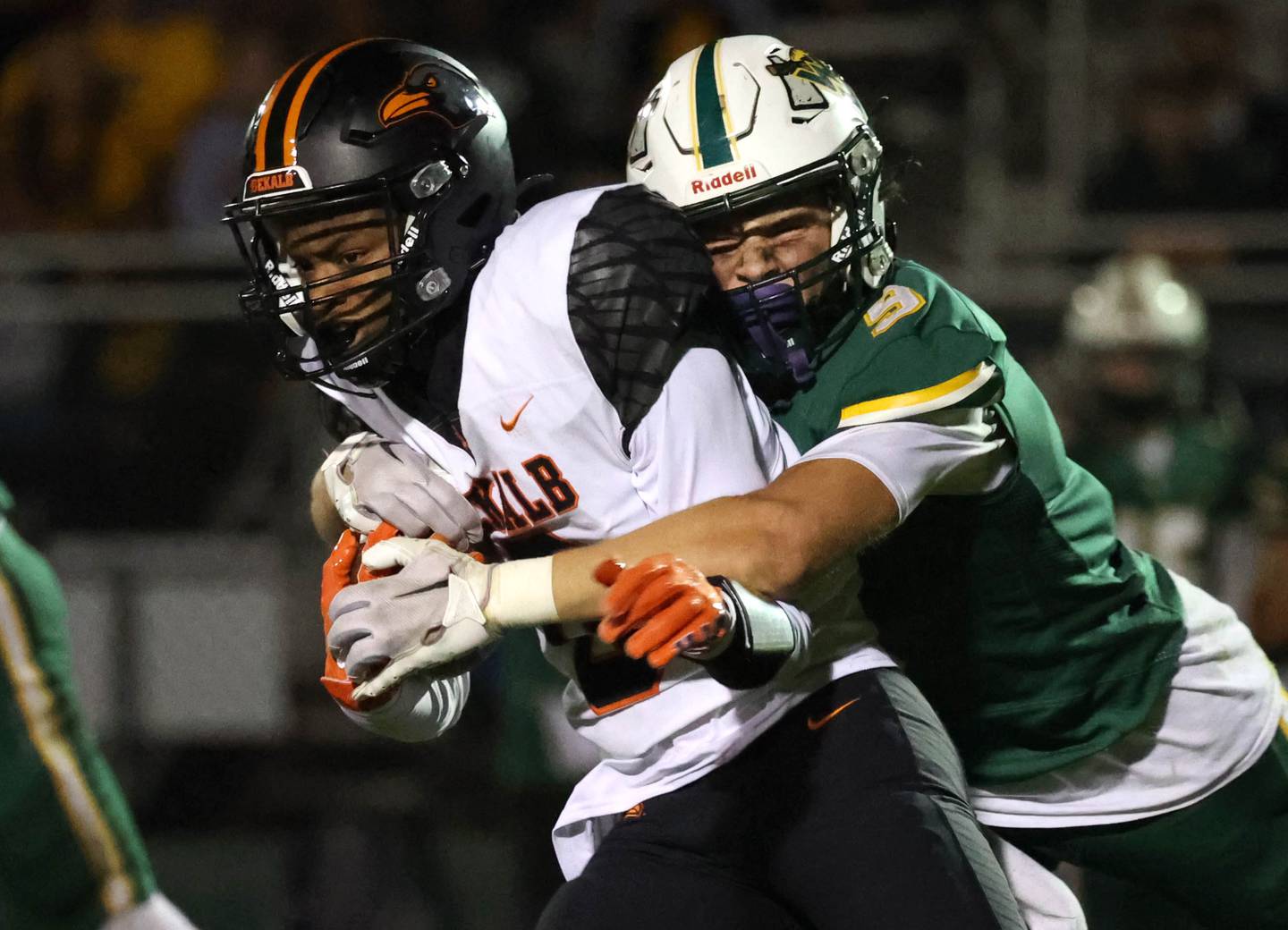 DeKalb's Billy Miller is wrapped up by Waubonsie Valley’s Owen Roberts during their game Friday, Oct. 11, 2024, at Waubonsie Valley High School in Aurora.