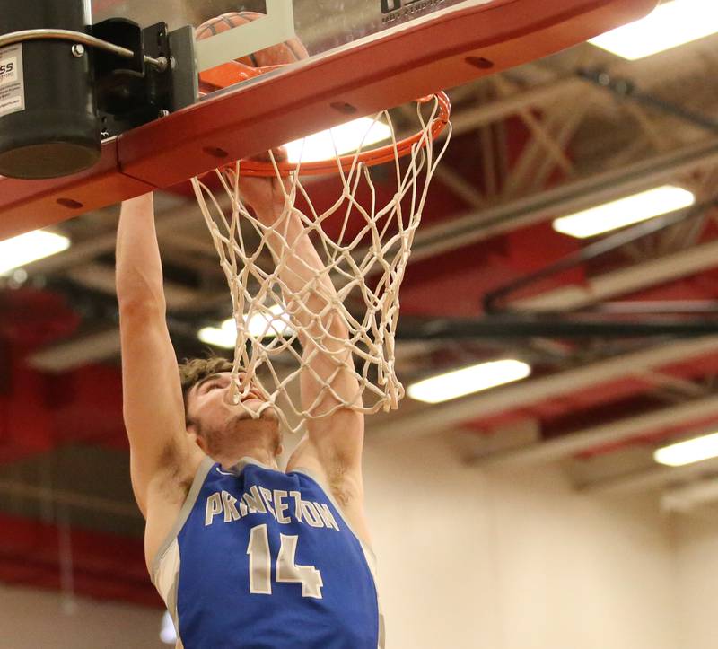 Princeton's Grady Thompson dunks the ball against Marquette during the Colmone Classic tournament on Friday, Dec. 9, 2022 at Hall High School in Spring Valley.